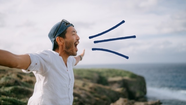 Man yells from the mountain top. 