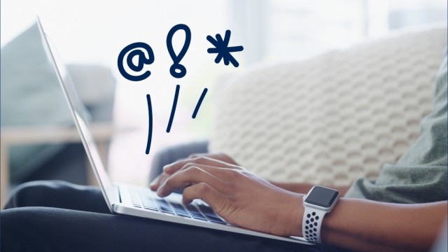 Hands typing on a laptop with doodles in the air.