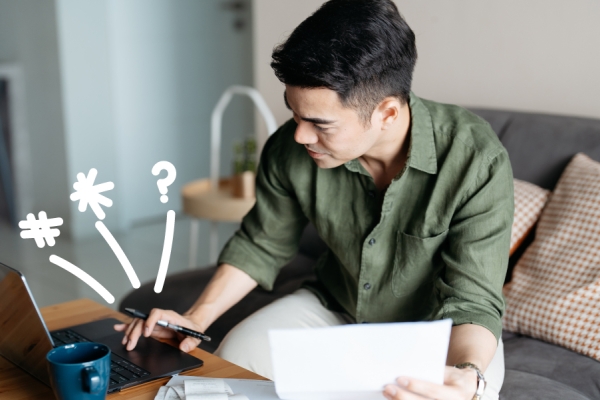 Man on his computer with doodles 