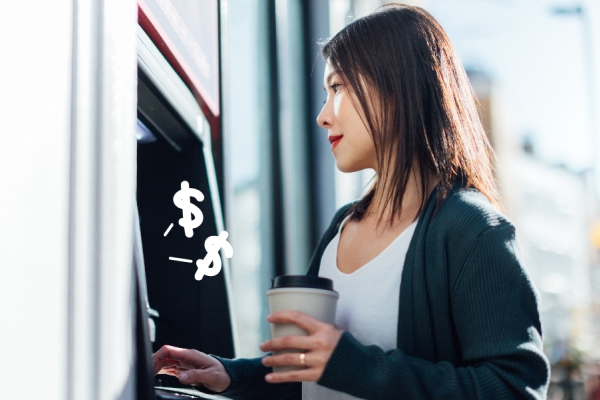Woman uses atm at a credit union