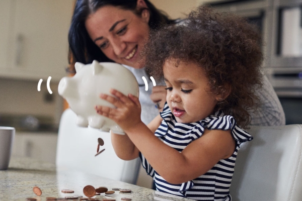 Mother and child with piggy bank