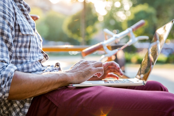 Man outside on laptop